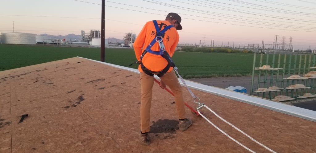 Roofing Contractor working on a commercial roof