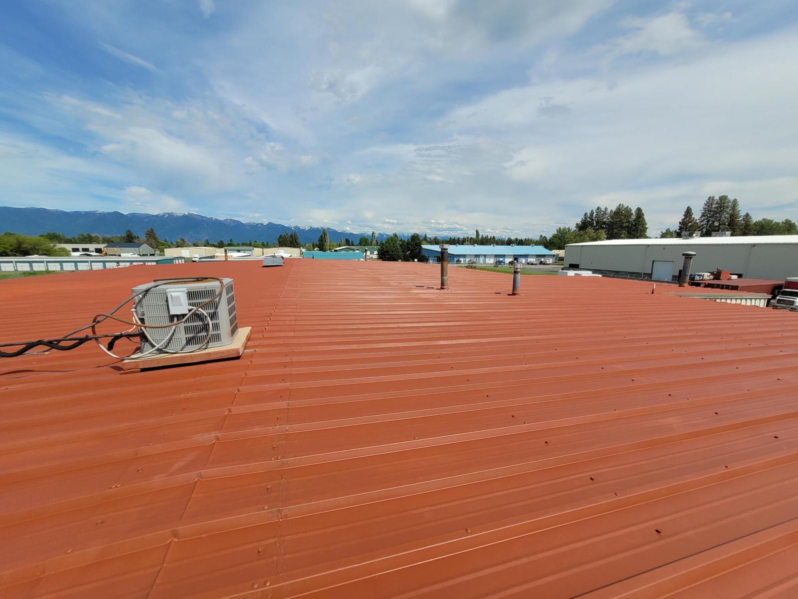 A metal Roof with fluid applied roofing protective coating